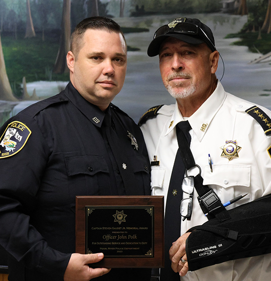 Officer John Polk pictured with Chief Sessions