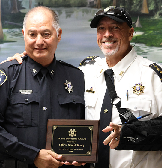 Officer Gerald Young pictured with Chief Sessions