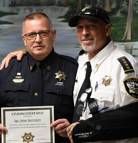 Sergeant Peter Herrmann pictured with Chief Sessions